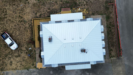 Overhead drone view of completed metal roof on San Marcos commercial building