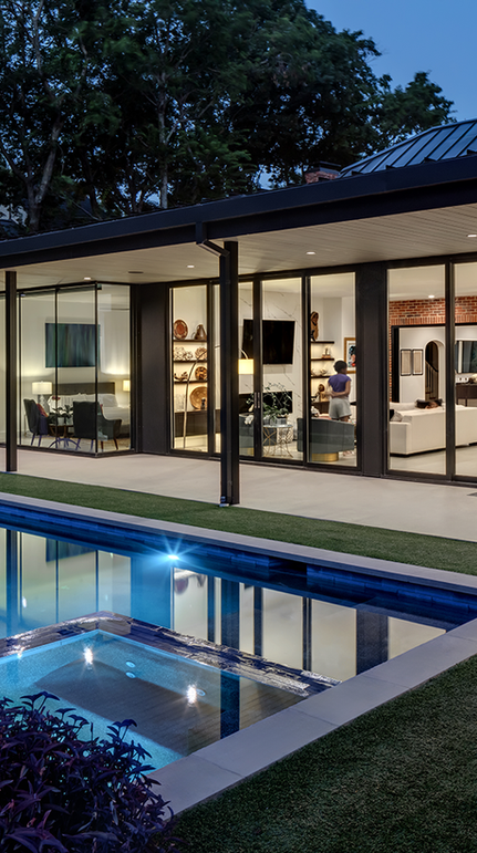 Modern exterior with pool and glass walls at dusk, Santa Clara Residence.