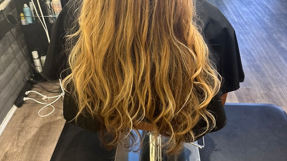 “Healthy shiny hair after expert hair color correction services by Ric Kent”