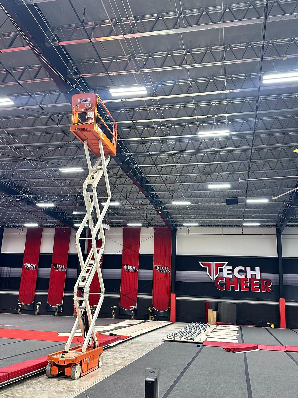 scissor lift and coordinated overhead cable routing