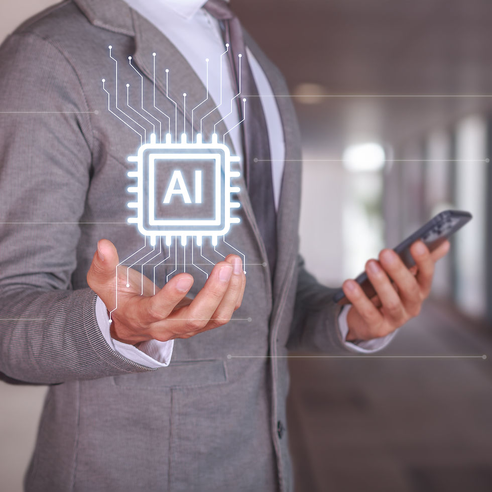 Person in a suit holding a phone, with a glowing AI chip hologram hovering above their open hand. Background is a blurred corridor.