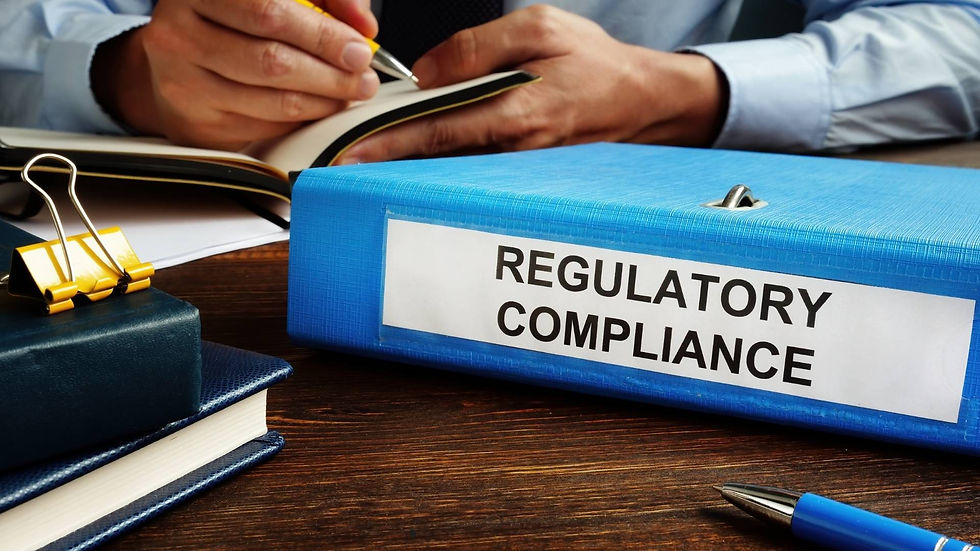 "A binder labeled 'Regulatory Compliance' on a desk, showcasing how IT managed security services ensure compliance."