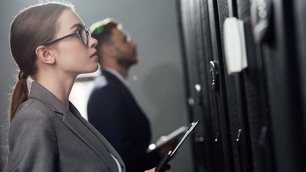 "Business professional analyzing server systems, reflecting the role of IT services in optimizing manufacturing infrastructure."