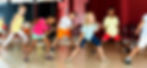 Focused kids studying modern style dance in class indoors.jpg