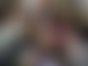 Six female-presenting volunteers from the University of Washington at Books to Prisoners and some are holding books