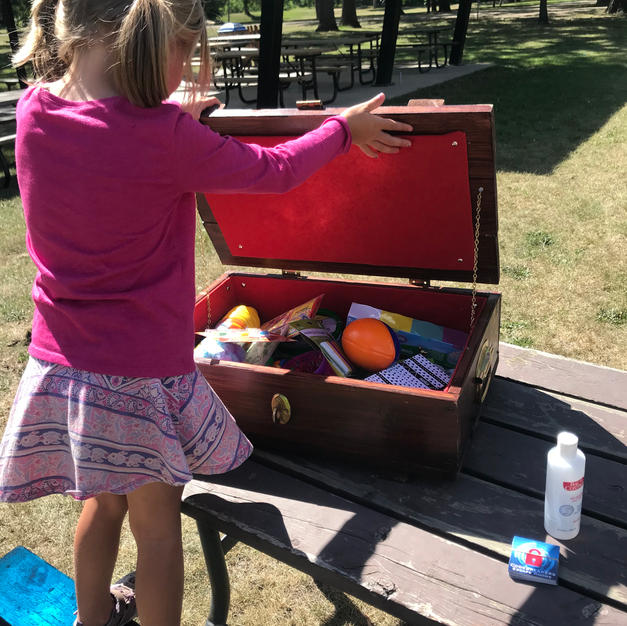 A tiny Monster Hunter claiming her prize