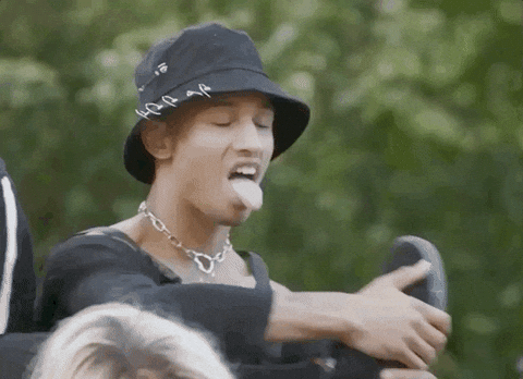 Man brings foot to his mouth and flicks his tongue at it to represent how pisces rules over feet and mercury retrograde in pisces can lead to foot in mouth syndrome