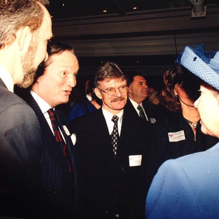 The Queen having a conversation with a group of people.
