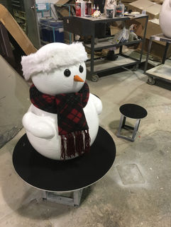 Large holiday snowman sculptures fabricated by Murmuration installed at the Oculus World Trade Center in New York