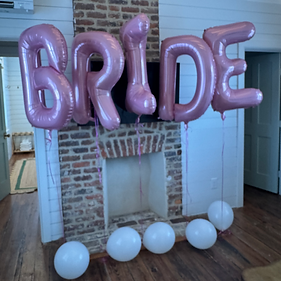 Special pink BRIDE balloons installed at the Royal Cottage for clients in from New York City