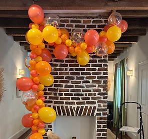 Colorful Custom Balloon arch installation based on a client's color scheme