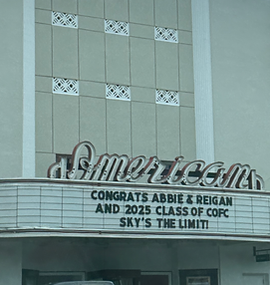 King Street's Iconic American Theater marquee with custom message celebrating a College of Charleston graduateC