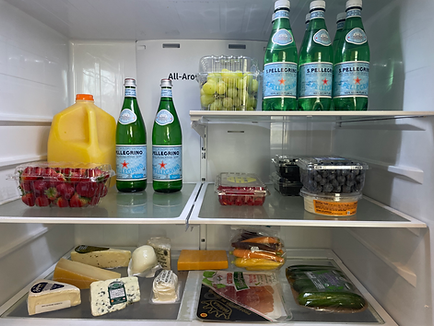 Fridge stocked with water, sodas, and refreshments for VRBO Charleston vacation guests