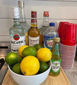 Mixers and fresh fruit prepared for celebratory cocktails in a Charleston vacation rental