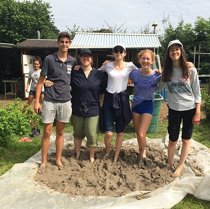 volunteers creating clay