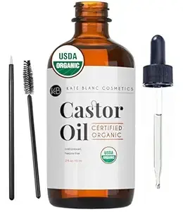 Brown bottle of USDA organic castor oil by Kate Blanc, with a dropper, brush, and applicator. Labels display "Certified Organic."