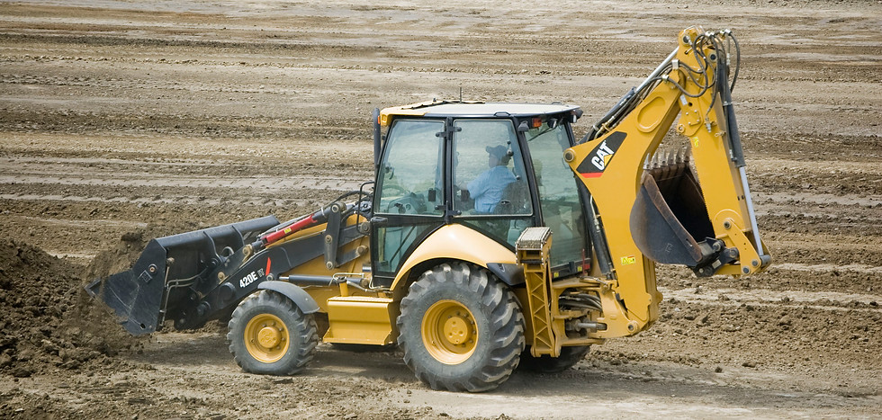 Backhoe loader service for land clearing, waste removal, and site levelling.