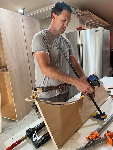 The owner working and building a peice of cabinets.
