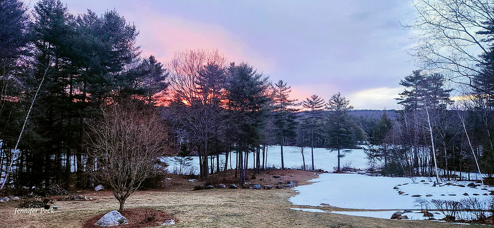 Early spring sunrise over a partially frozen lake surrounded by trees, representing waking early and aligning with nature’s rhythms in Ayurveda.
