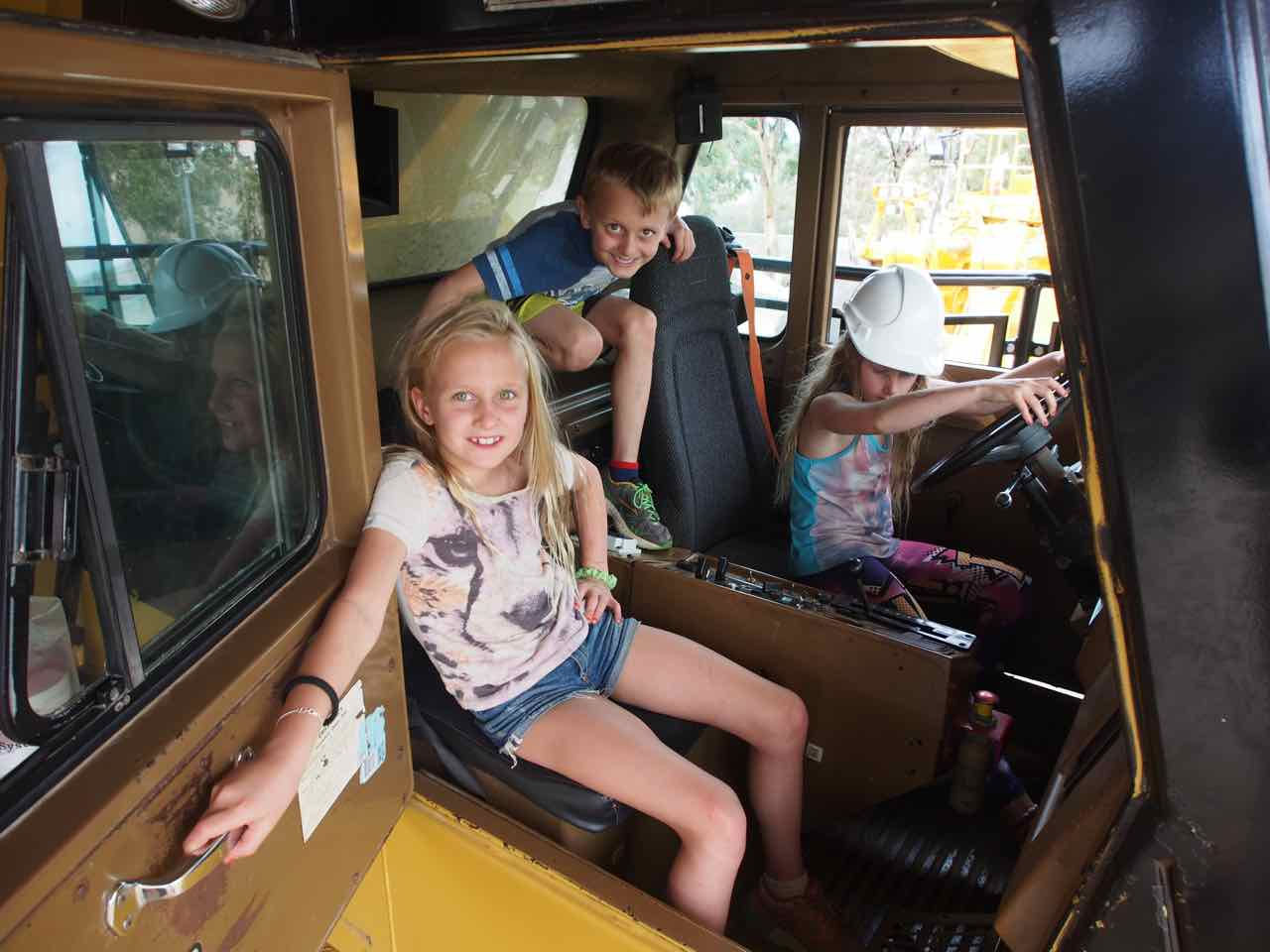 kids in cabin of tip truck