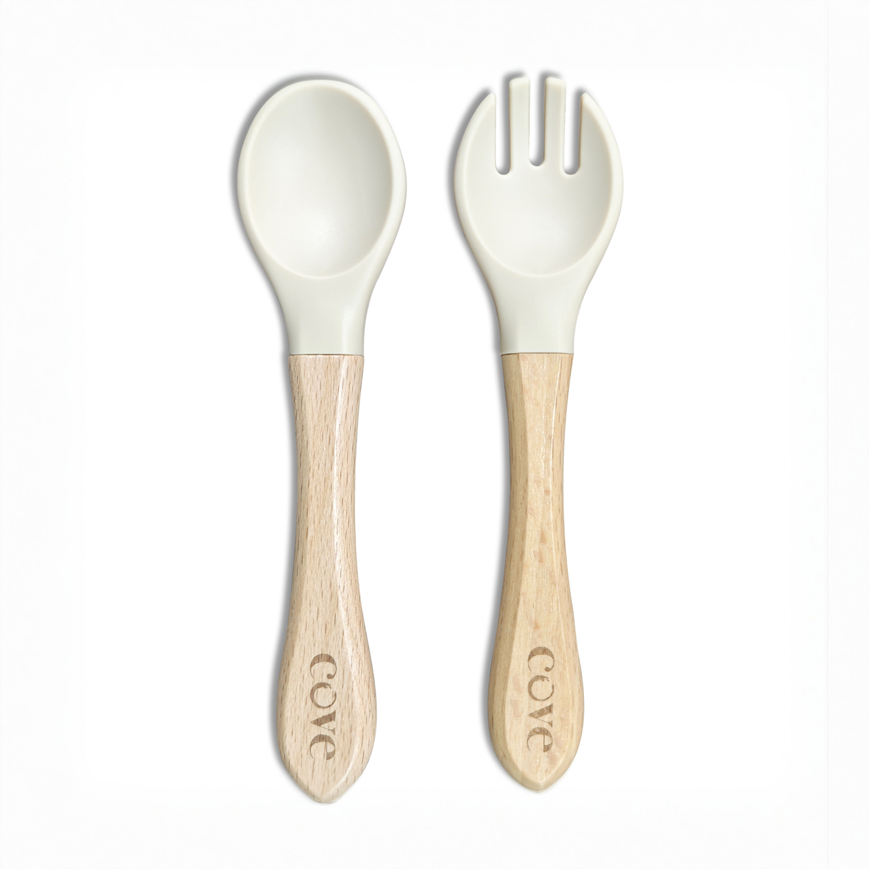 a cream wooden and silicone spoon and fork cutlery set for a baby