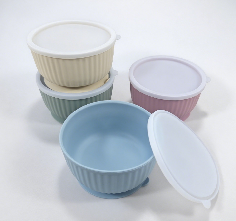 a selection of silicone bowls with lids