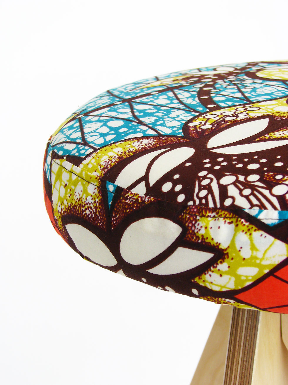 wooden stool with african wax print upholstery