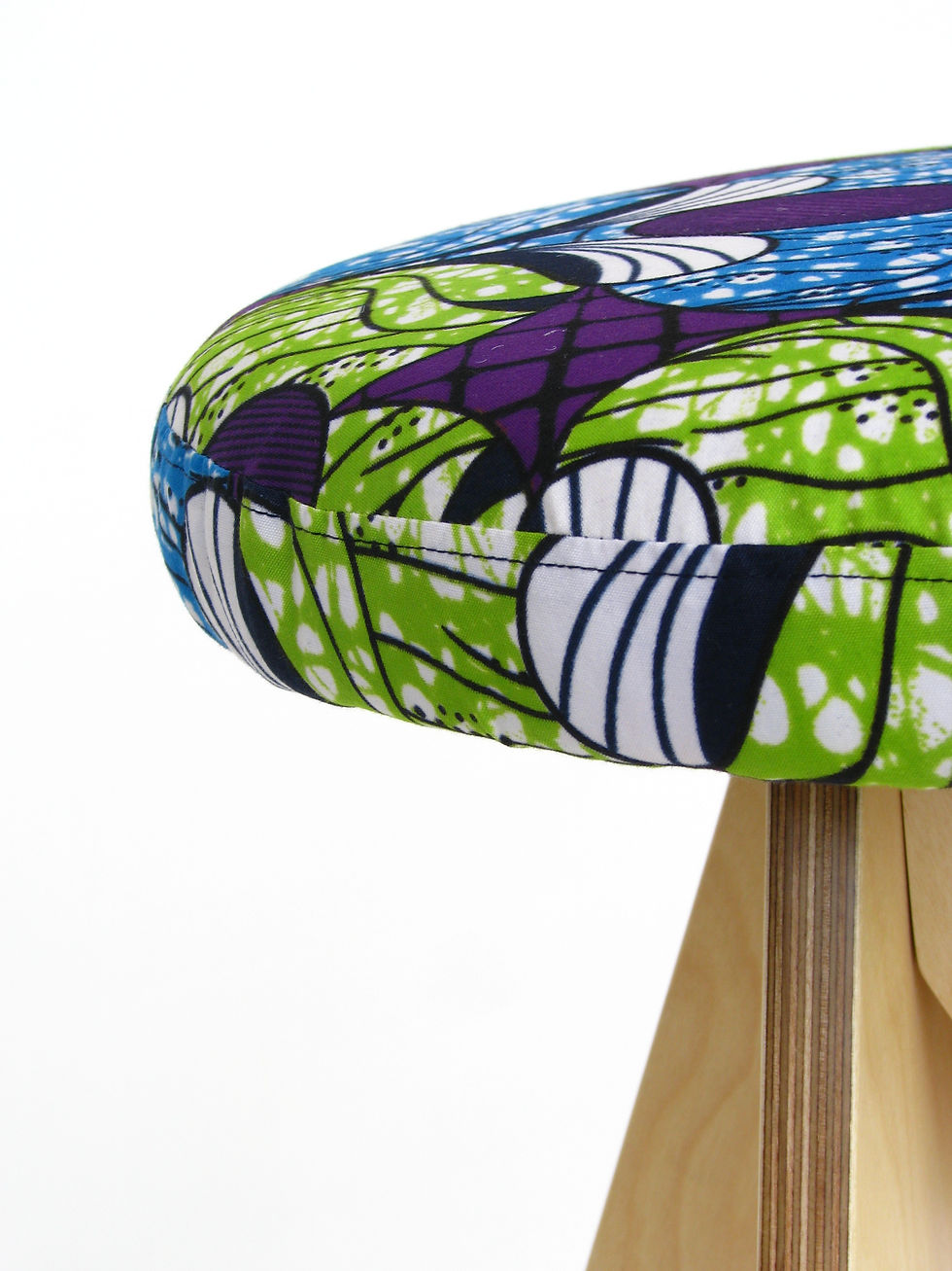 wooden stool with african wax print upholstery