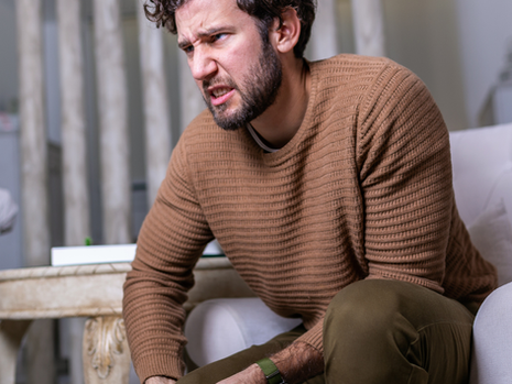 Man holding his knee due to pain