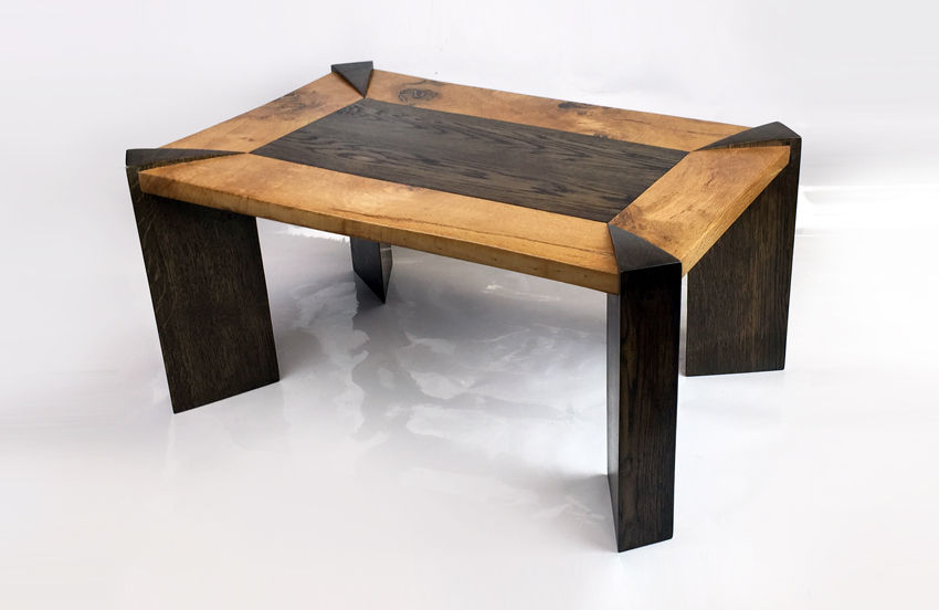 Fumed and light Oak modern coffee table on white background.