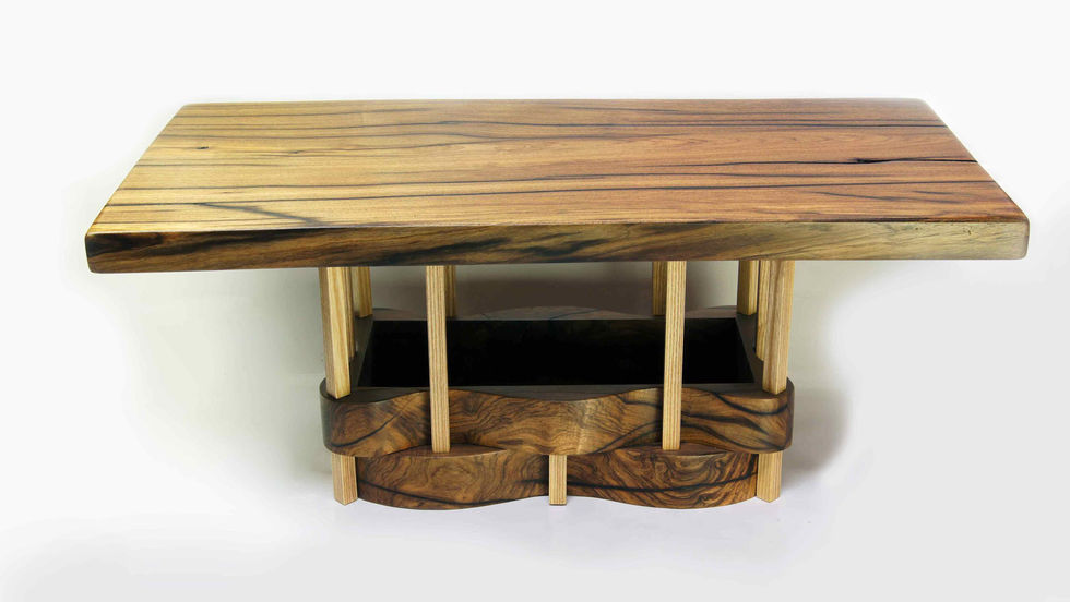 Wooden table with unique geometric base design.