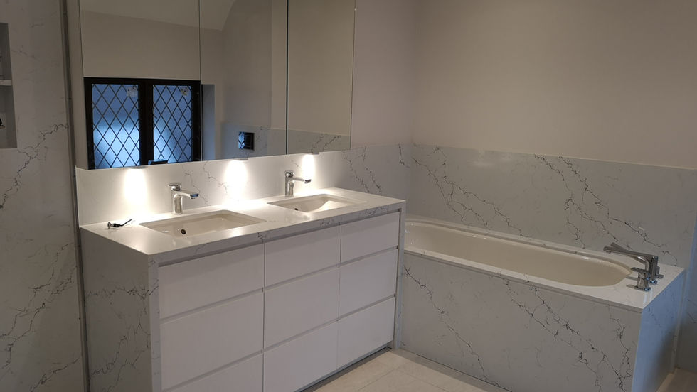 modern vanity unit with large mirrored cabinet above set in modern bathroom