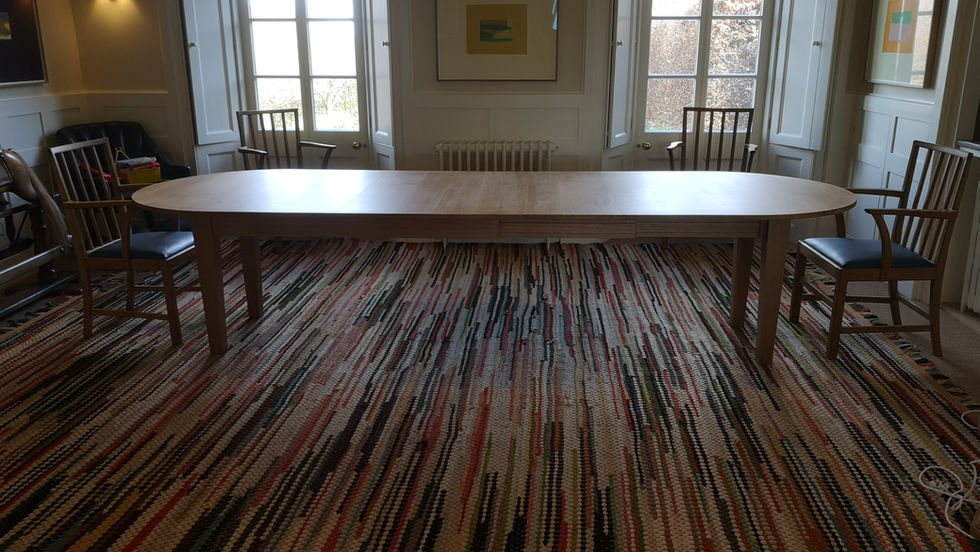 Extendable solid oak dining table set in the elegant décor room 