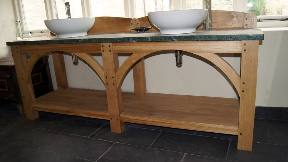 Solid Oak washstand with two round basins sitting on the top of green colored marble countertop