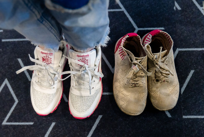 Two pairs of children’s shoes placed side by side during a First Day Shoe Fund event in Kalamazoo, Michigan.