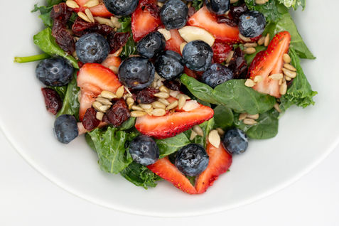 Farm-to-table salad Michigan with strawberries blueberries spinach