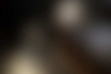 Firefighter boots and chief helmet resting on a bench inside Sherman Township Fire Department in Ruth Michigan.