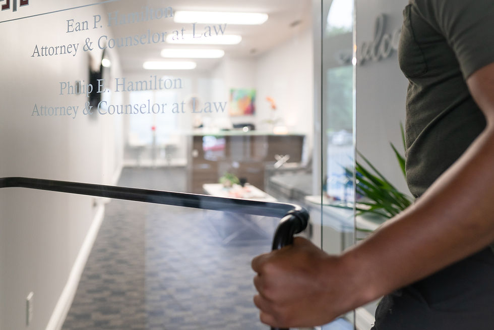 Man opening the door to a law office in Kalamazoo, Michigan