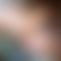 a dad kisses his newborn son