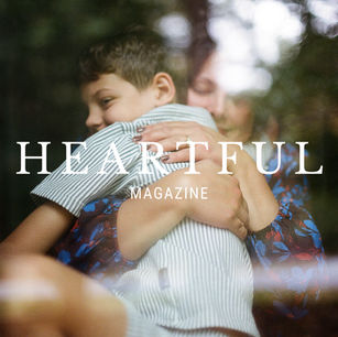 The Heartful Magazine logo overlayed on a tender image of mom hugging son.