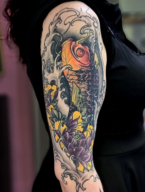 A cover-up tattoo featuring a large koi fish integrated with Japanese-style water, surrounded by delicate cherry blossoms and peonies