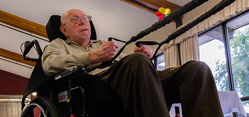 Man in wheelchiair exercising