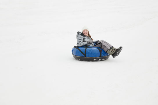 Woman Snow Tubing