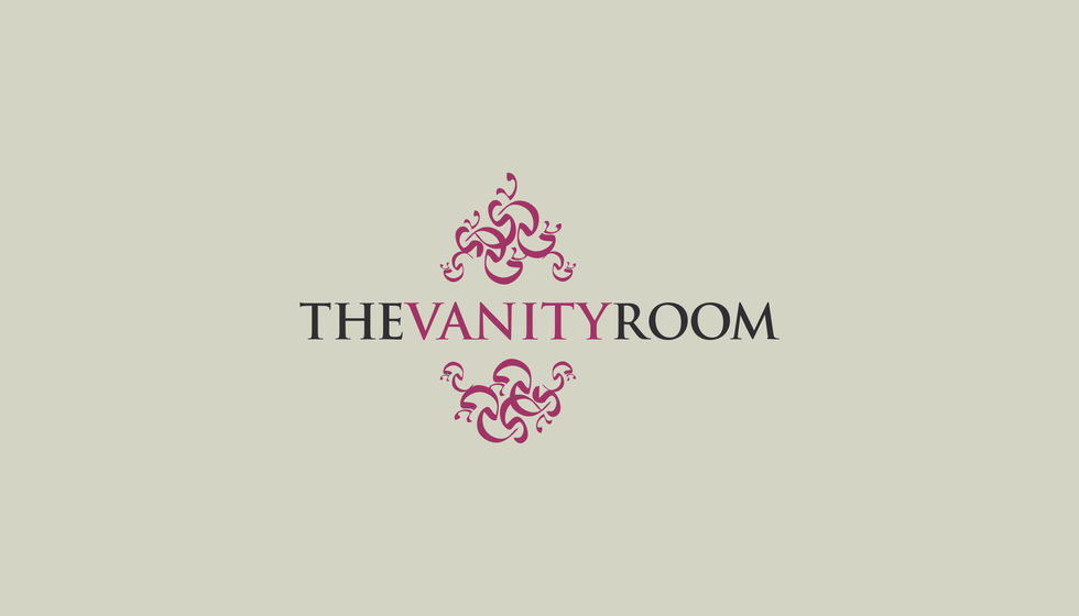 a logo for the vanity room with a floral design