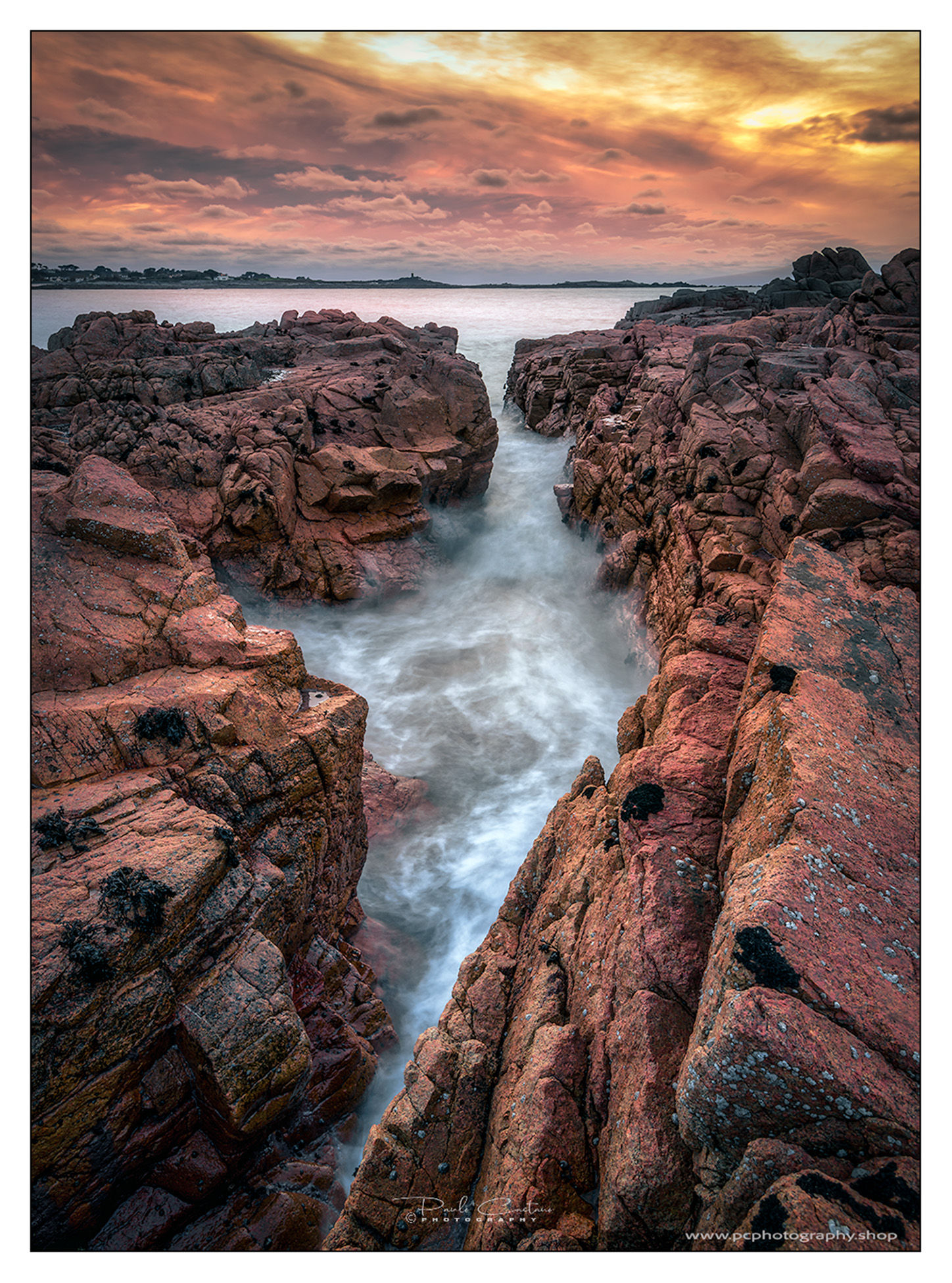 PC32787 - Fiery Sunset Over the Craggy Shores of Grandes Rocques