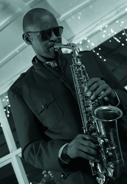 Black and white photo of a guy playing sax