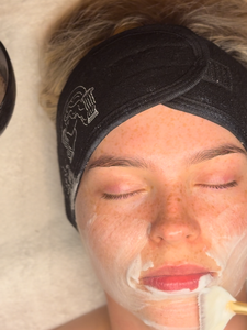Client enjoying a hydrating facial at a top-rated Leeds skincare clinic
