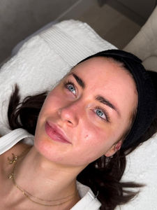 Professional aesthetician performing a deep cleansing facial in Leeds