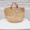 Thumbnail: KATALE; Beige woven storage/planter/shopper  basket with short leather straps
