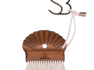 It swipes sand off your feet & beach bag